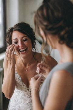 A candid photograph captures a moment of joy and preparation. wedding