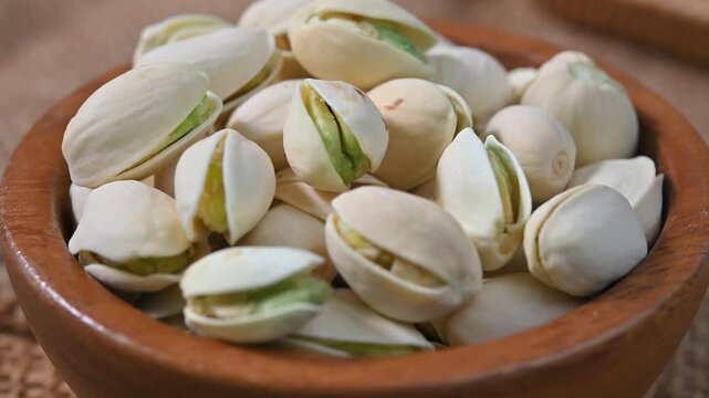 Close-up of roasted pistachios with natural texture and crunchy appearance. Healthy nut snack suitable for food, nutrition, and healthy lifestyle concepts.