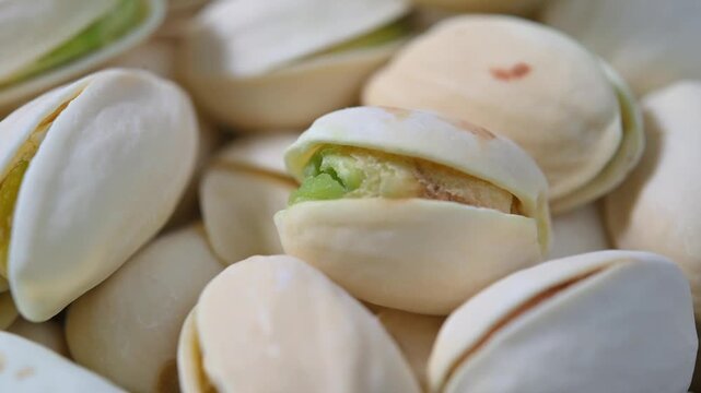 Close-up of roasted pistachios with natural texture and crunchy appearance. Healthy nut snack suitable for food, nutrition, and healthy lifestyle concepts.