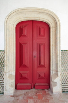 Red Door in Arched Stone Doorway in Portugal