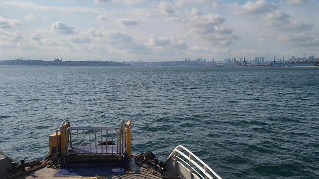View of city skyline from boat on water during day