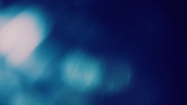 Abstract soft blue and white light leak overlay effect for video editing.