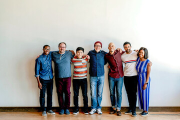 Fototapeta premium Diverse group of smiling men and women standing together indoors