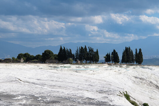 White travertine terraces and thermal pools in Pamukkale, Turkey.