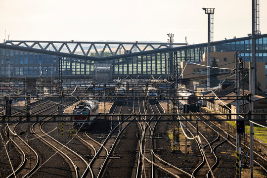 Poprad, Slovakia - July 25, 2026: Wide high-angle view of multiple railway tracks, catenary wires, and modern station building at Poprad-Tatry railway station.