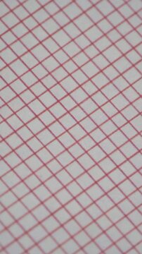 Slow Pan Macro View Of Minimalist Red Line Grid Pattern On White Paper