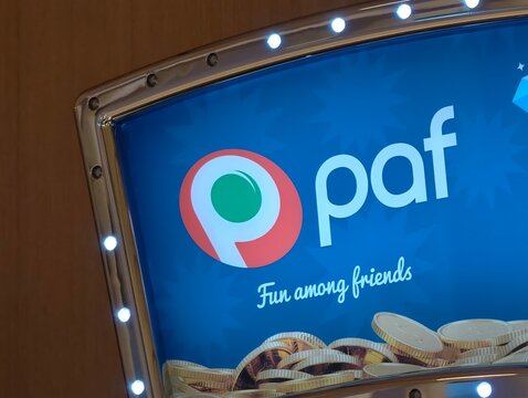 Helsinki, Finland-Nov. 29th 2025: Paf brand logo sign with slogan "Fun among friends" on a gaming machine display.