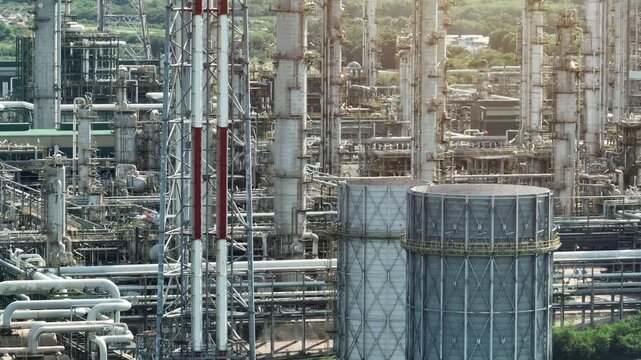 High-angle aerial capture of an integrated petrochemical plant illustrating complex engineering, power generation efficiency, fossil phase-down strategies and the future of industrial decarbonization.