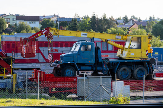 Poprad, Slovakia - July 25, 2026: Praga V3S truck crane mounted on flatbed railway wagon at Poprad-Tatry station.