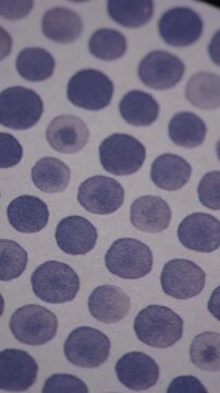 Vertical Panning Shot Of Abstract Purple Polka Dot Pattern Background