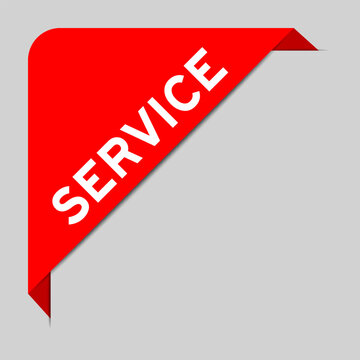 Red color of corner label banner with word service on gray background