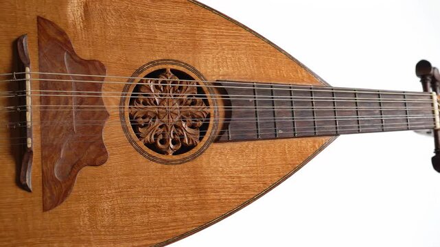 Close up of an authentic wooden oud with intricate rosette detail