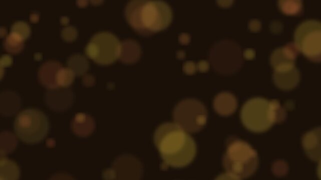 Abstract golden bokeh particles drifting slowly across a dark atmospheric background
