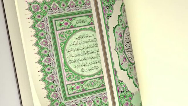 Close up video of ornate Quran pages with Arabic calligraphy.