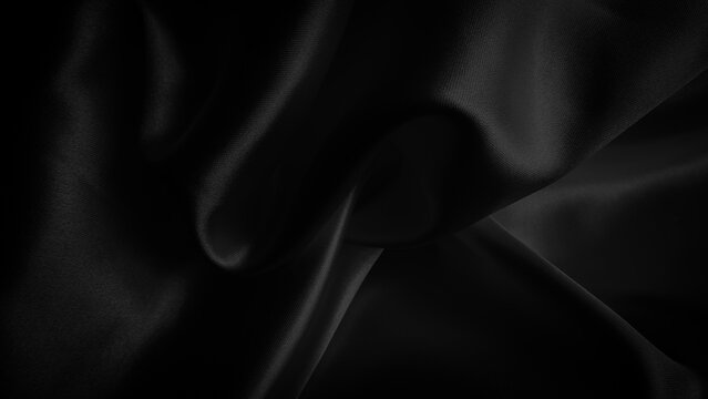 Smooth elegant black silk fabric waves background texture with luxurious silky shine and dark rich shadows. Close up of draped black satin material showing smooth folds and soft light reflections