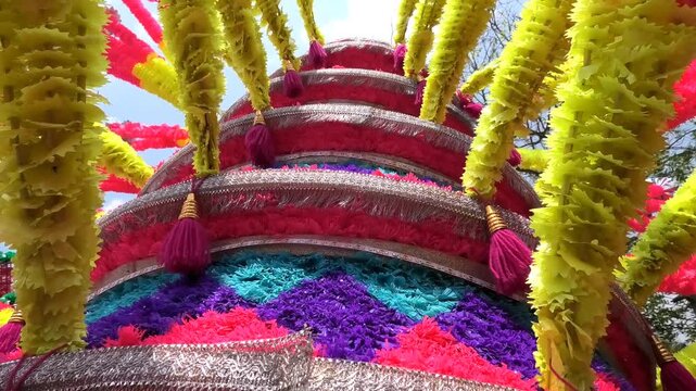 Closeup of colorful spinning structures traditionally used in the 'Kavadi' procession of temple festivals in South India
