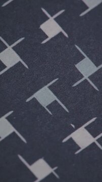 Vertical Macro Shot of Abstract Houndstooth Print on Dark Textile
