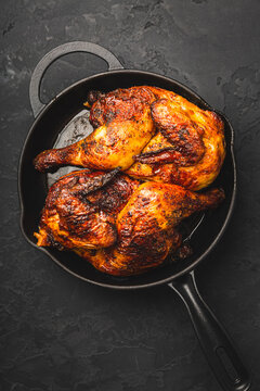 Juicy and crispy roasted chicken thighs in a cast iron skillet