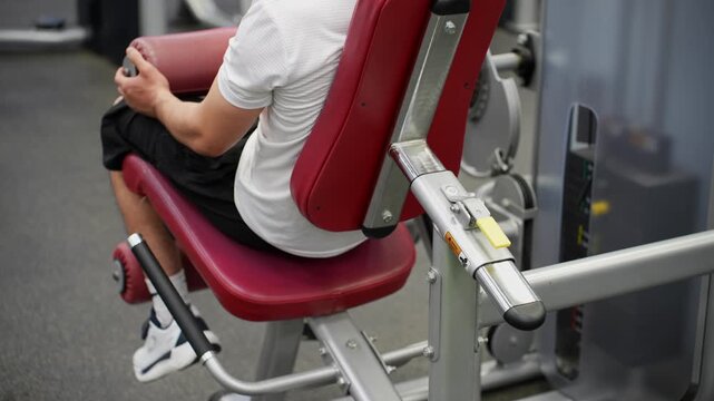 Performing the seated leg extension exercise