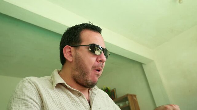 Mexican man enjoying traditional enchiladas meal