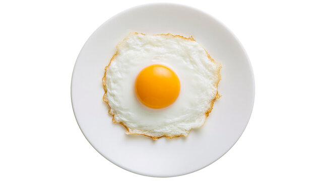 Sunny side up fried egg with bright yellow yolk on a white plate, isolated on transparent background