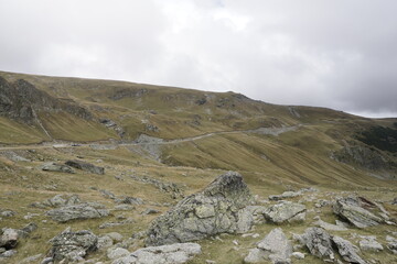 Scenic mountain road and rocky landscape along Transalpina highway in Parang Mountains, Romania © Damian