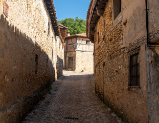 Fototapeta premium Narrow cobblestone street in Calatañazor medieval village, Spain