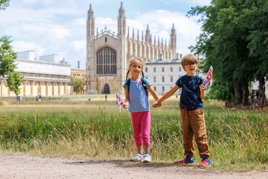 Two children near Kings College Chapel, waving flags, Cambridge