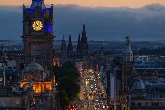 Edinburgh cityscape at dusk, bright Princes street, Scotland