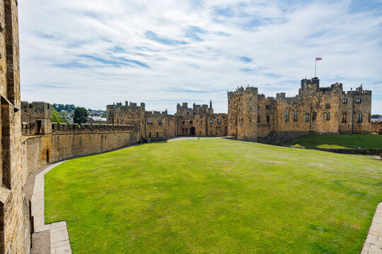 Historic Alnwick castle fortress courtyard and walls, England