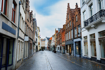 Fototapeta premium Cobblestone street Smedenstraat, lined with historic townhouses