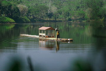 Fototapeta premium People are catching fish using nets in the lake