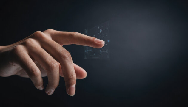 A hand interacts with a futuristic transparent touchscreen interface against a dark background.