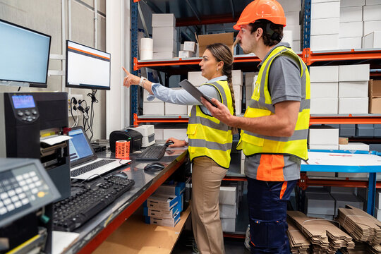 Warehouse workers managing inventory and logistics operations