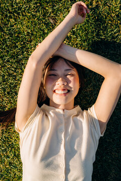Portrait of a woman lying on the grass