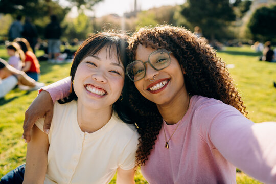 Two women taking selfies