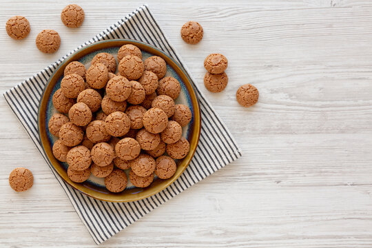 Homemade Italian Almond Amaretti Cookies on a Plate, top view. Copy space.