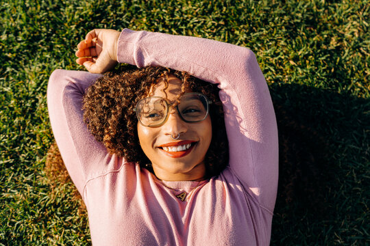 Portrait of a woman lying on the grass