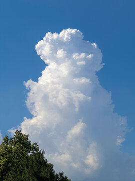 Fluffy white cloud and blue sky background