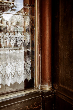 Curtains Hang by a Window in a Shop During the Day