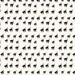black cat silhouettes on cream background for design © MdRakibul