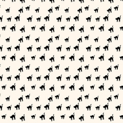 black cats pattern on cream background for halloween © MdRakibul