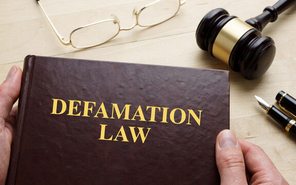 Law Book with Judge Gavel Defamation Law Legal Concept