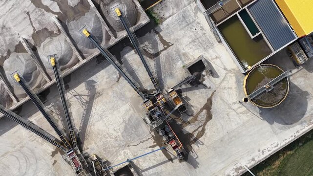 Aerial top down view of industrial gravel quarry processing plant