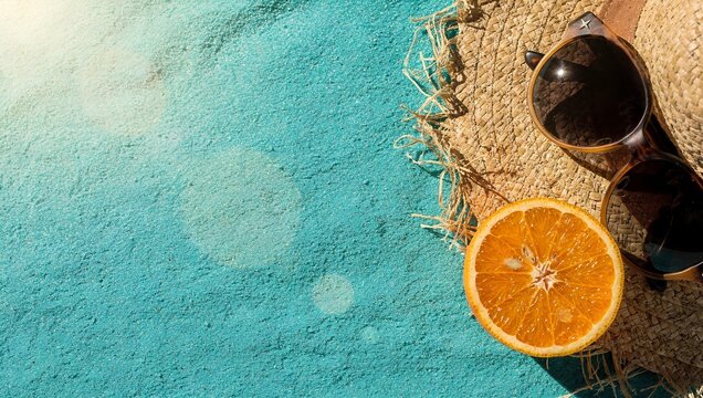 Vibrant summer travel background with straw hat and copy space