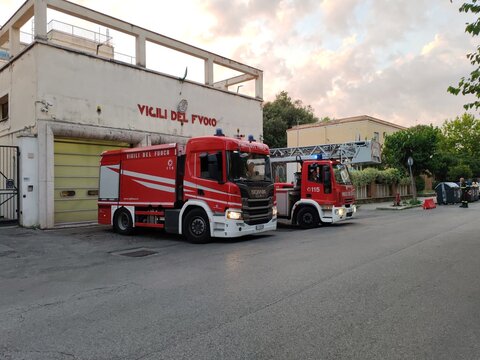 Ostia, Rome, Italy - December 14, 2025, view of the historic building, with the red sign, which houses the Fire Brigade, with an operational vehicle ready for a call.