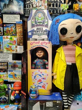 Rome, Italy - June 20, 2025, some collectible toys, including Child's Play, Buzz Lightyear, and a dark doll, in anticipation of the Halloween party, in the window of a collectible toy shop.