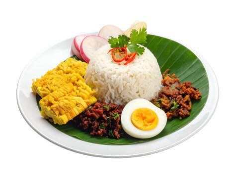 Nasi Campur Indonesian Rice Dish with Egg and Spicy Meat Served on Banana Leaf