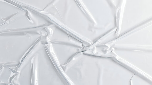 Crushed White Plastic Film Texture with Dramatic Lighting and Deep Shadows