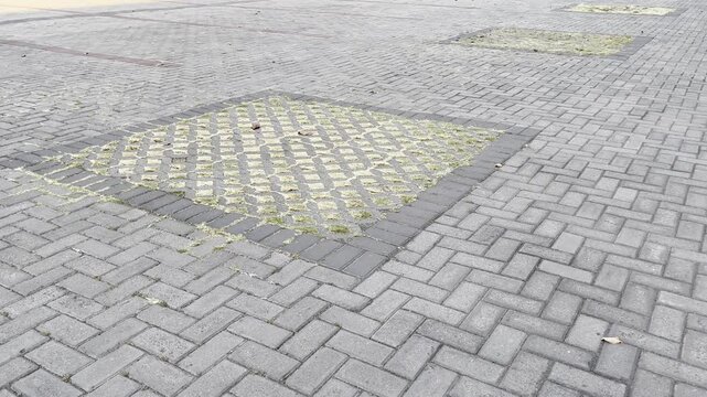 Interlocking concrete paving blocks with yellow and black pattern
